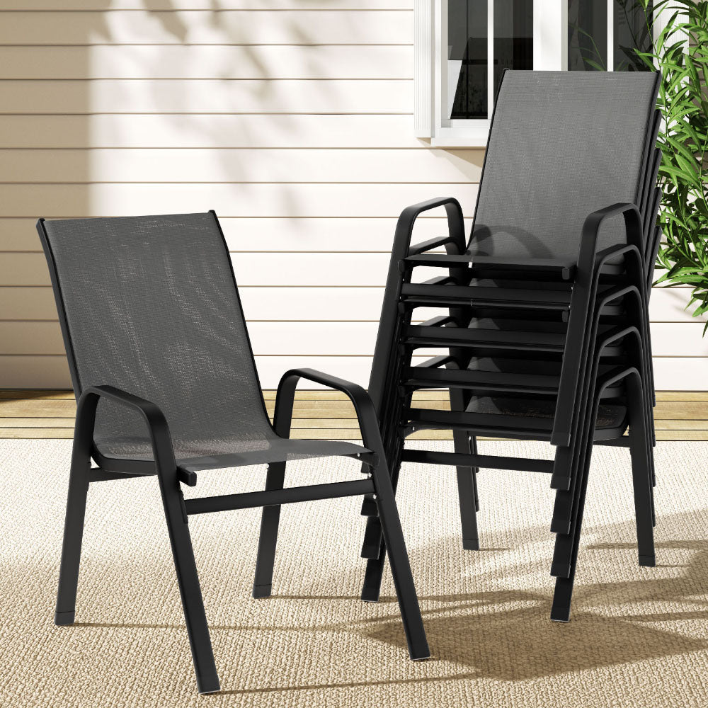 Stackable outdoor chairs on a patio with a neutral background