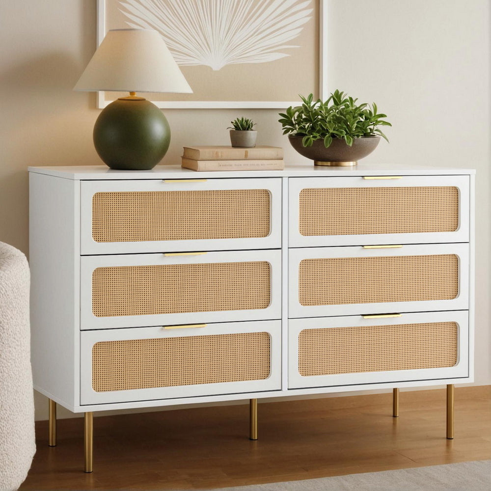 White dresser with wicker drawers in a room setting