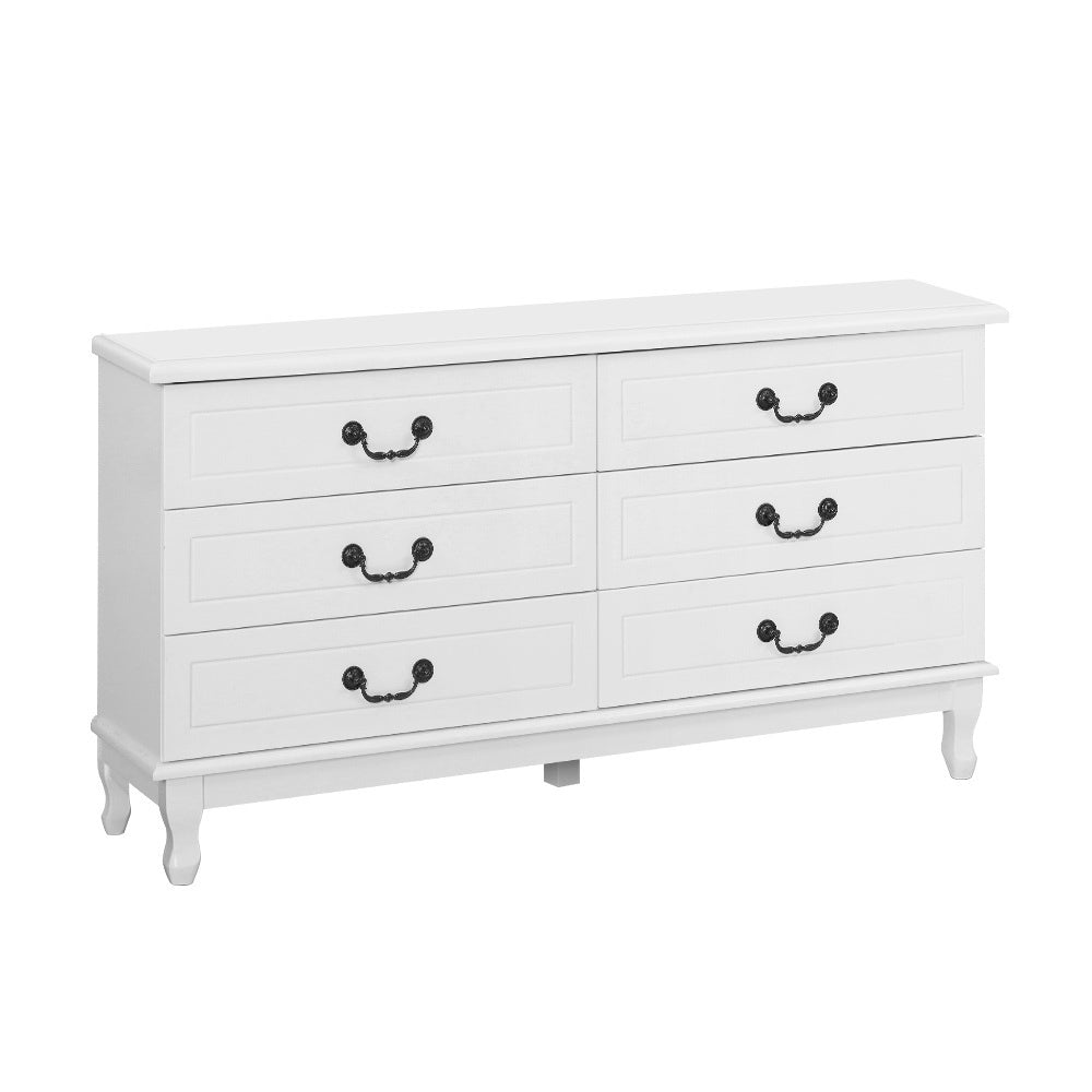 White dresser with black handles on a white background