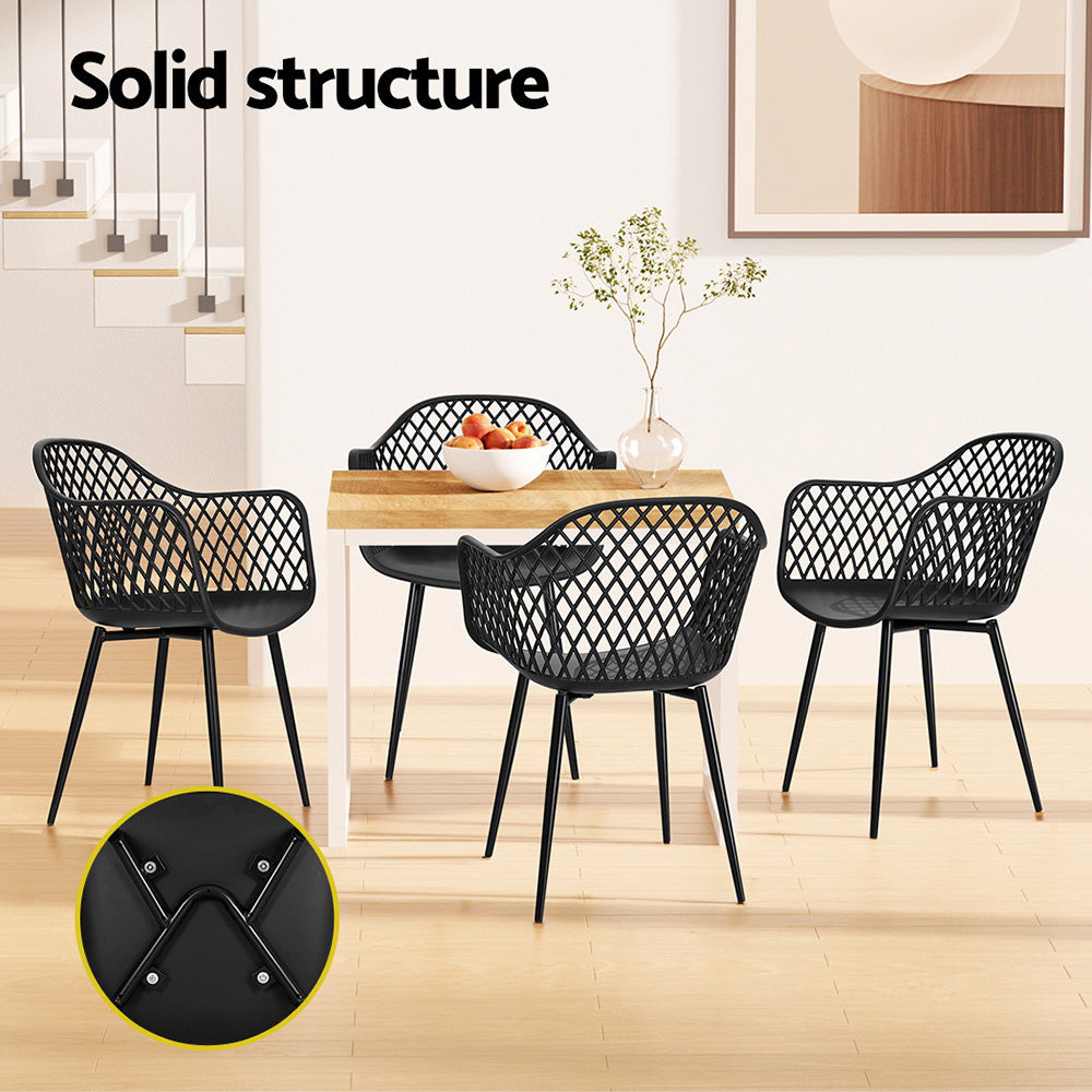 Black lattice chairs around a wooden dining table with a close-up of a chair leg.