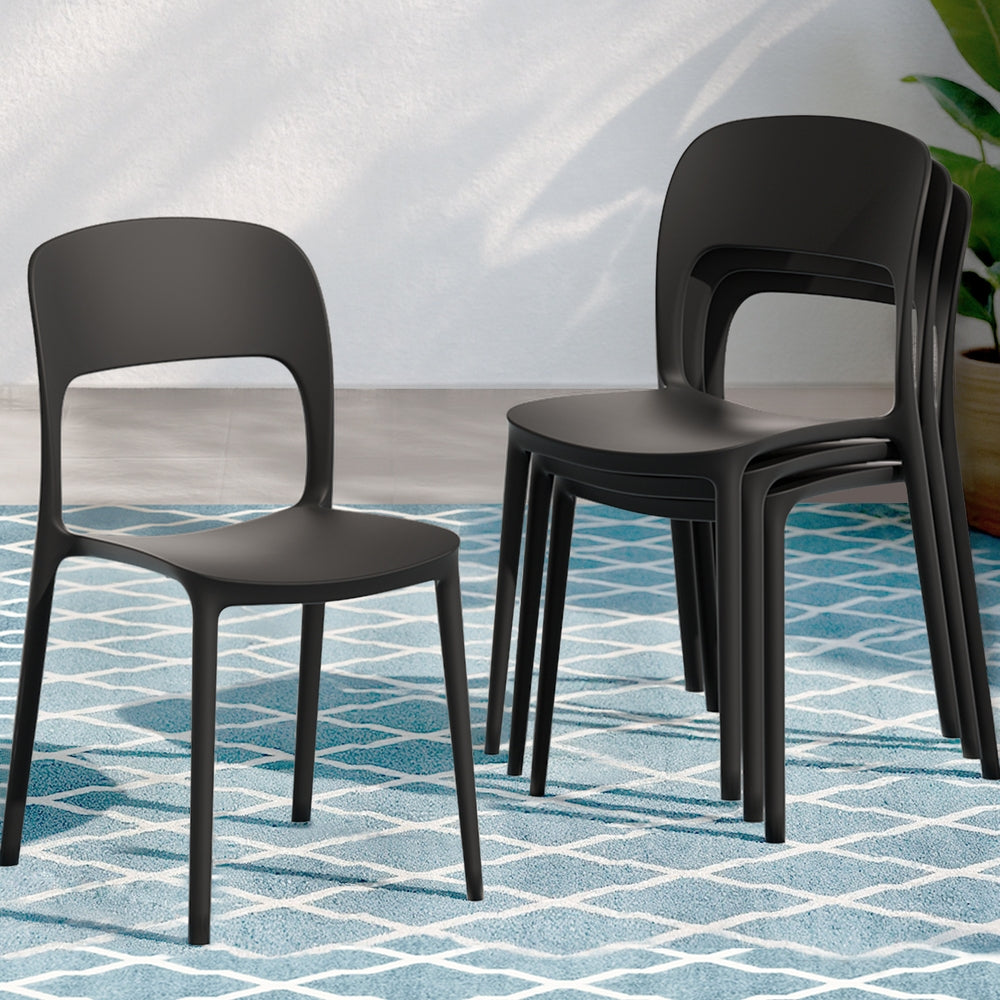 Black chairs stacked on a blue and white patterned floor