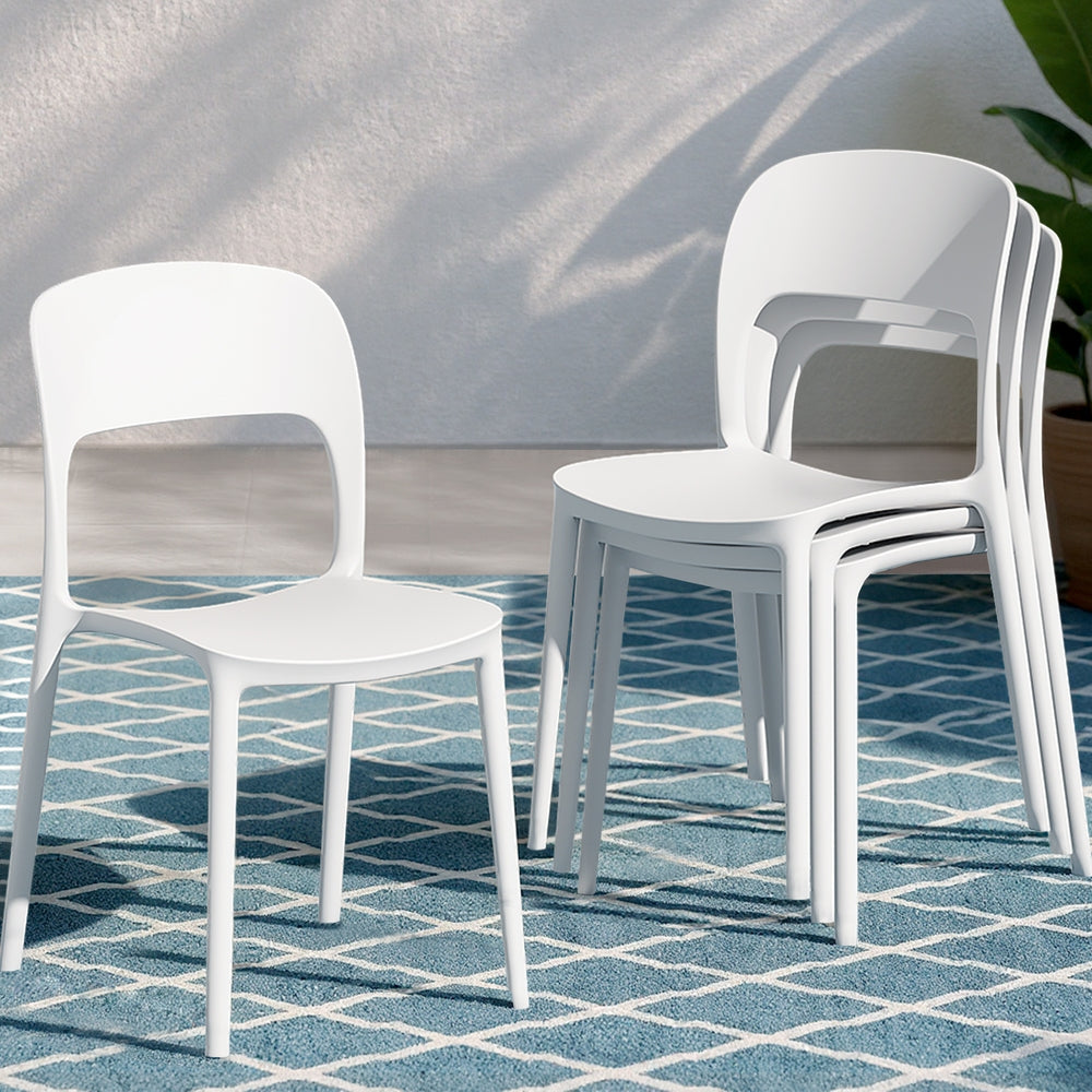 White chairs stacked on a blue patterned floor
