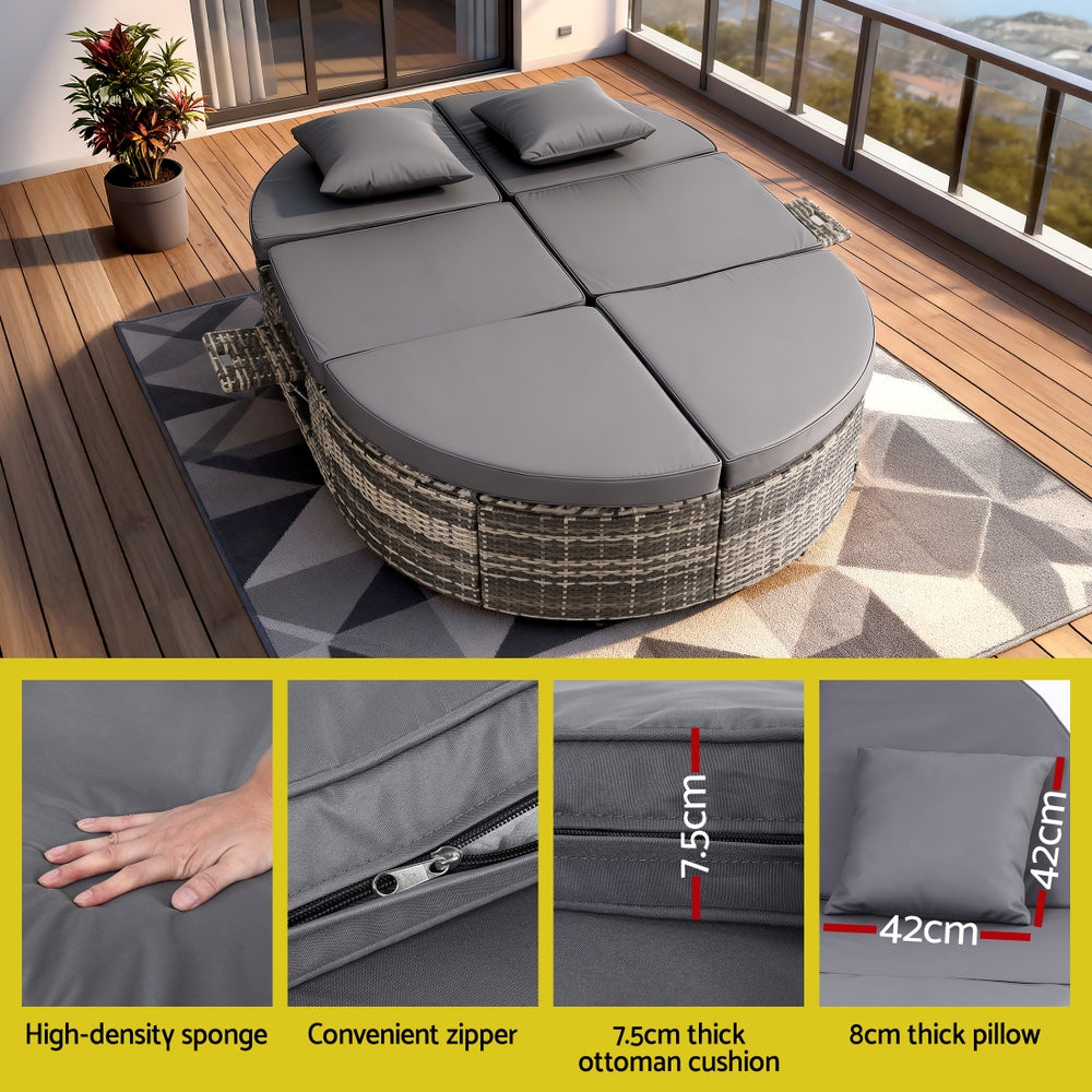 Outdoor patio furniture set with cushions on a wooden deck