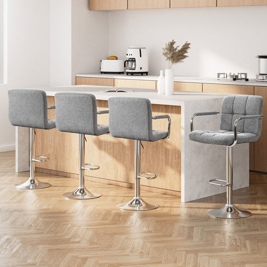 Modern kitchen with gray bar stools around a island.