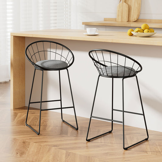 Two black wire bar stools with gray seats in a kitchen setting.