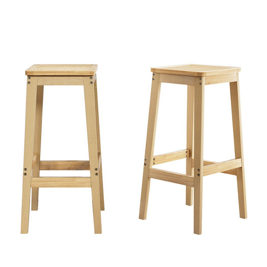 Two wooden bar stools on a white background