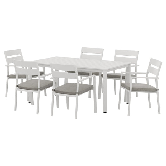 White dining table with four matching chairs on a white background