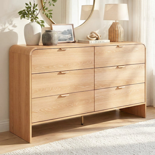 Wooden dresser with decorative items in a room setting