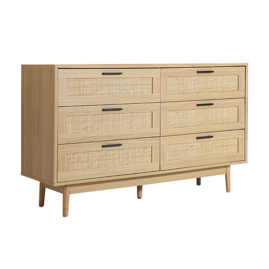 Wooden dresser with woven drawer fronts on a white background