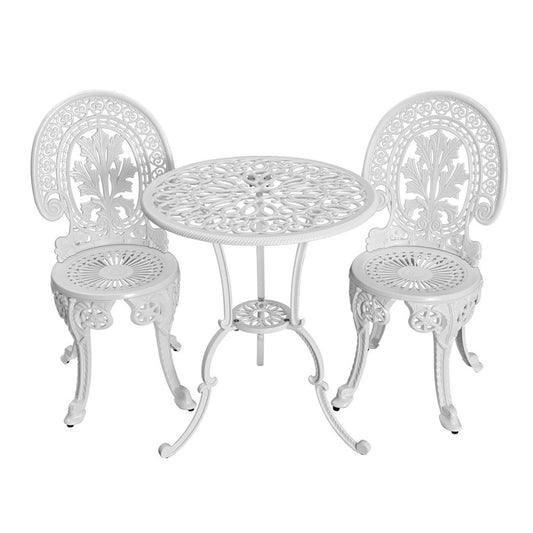 White metal outdoor table and chairs set on a white background
