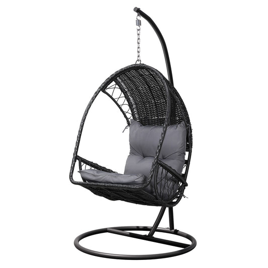 Black wicker swing chair with gray cushion on a white background