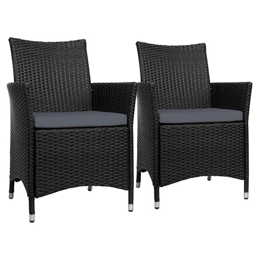 Two black wicker chairs with gray cushions on a white background